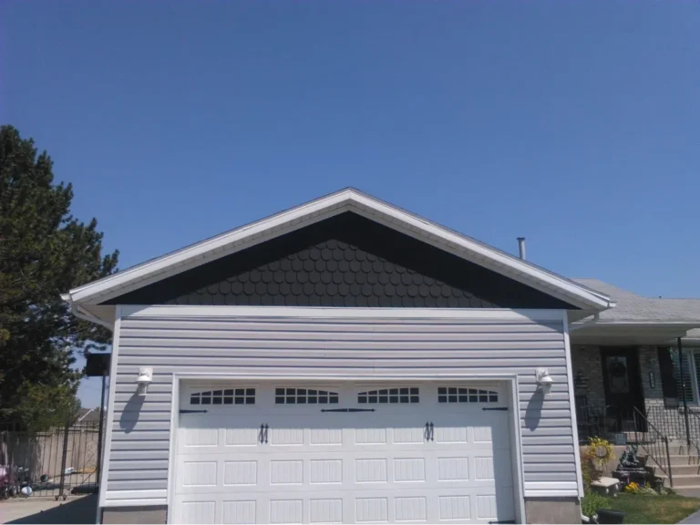 Garage door with a modern design and clear sky background