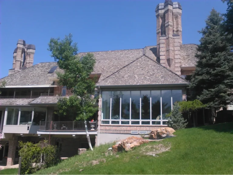 Large house with a grand roof and steep slope