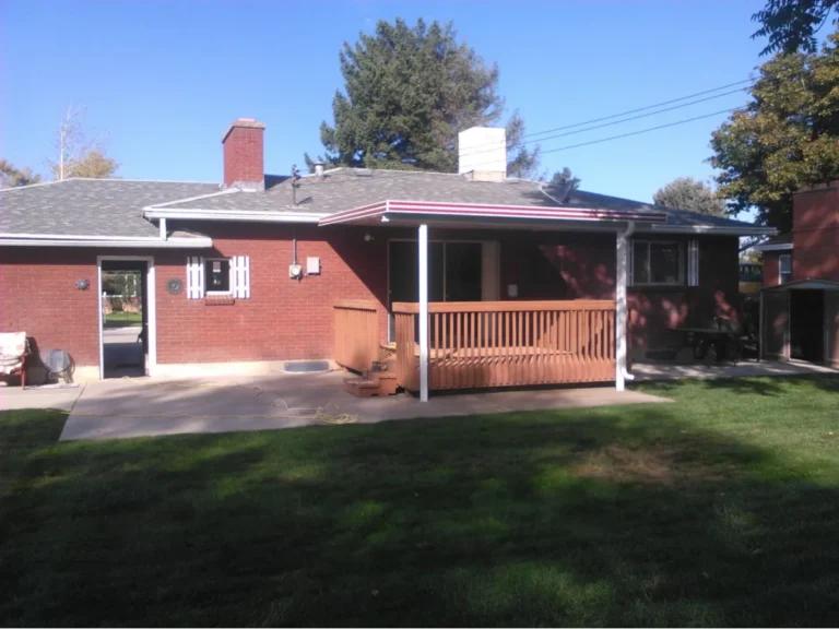 Large red brick house with a front porch