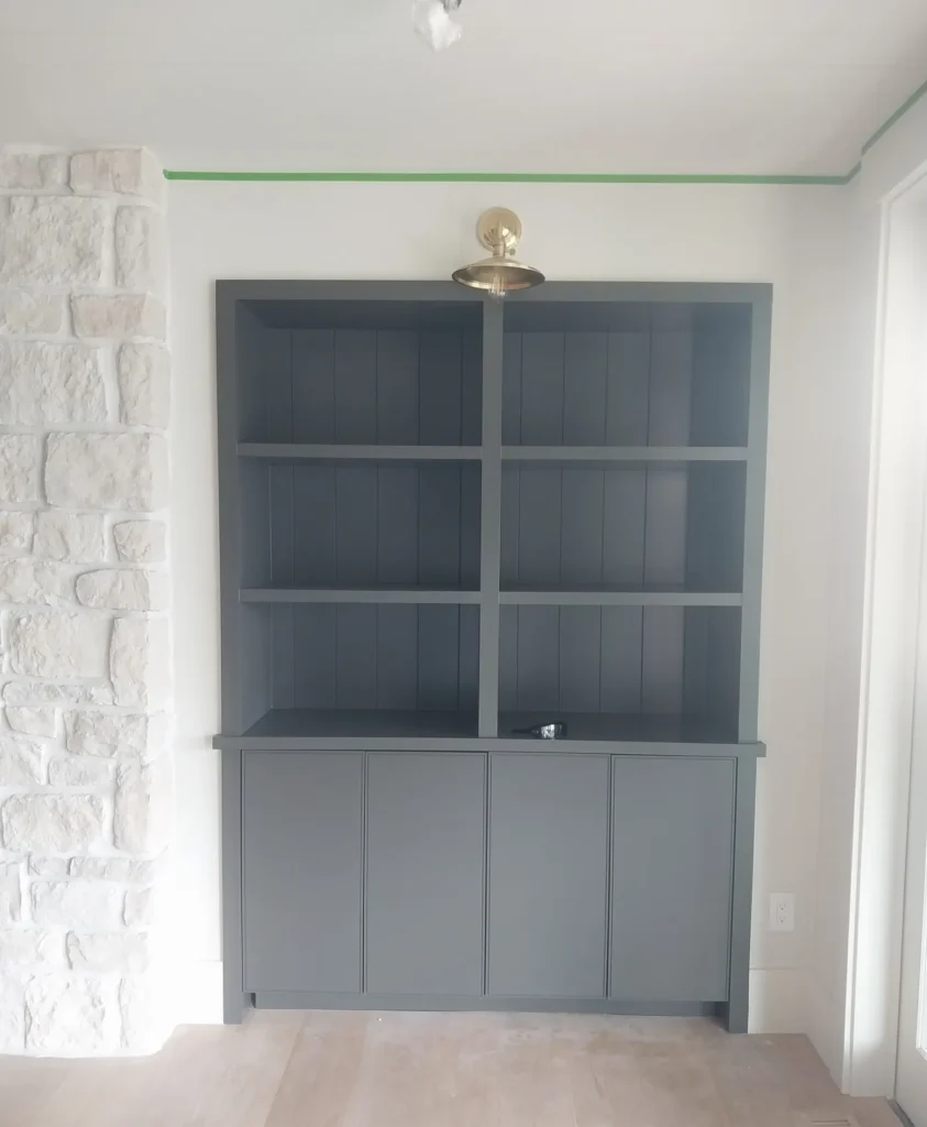 Wide shot of a home with clear skies and green grass